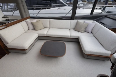 Luxurious interior of 2025 Princess S65 yacht with elegant seating and modern design.