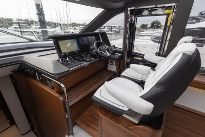 Luxurious 2025 Princess S65 yacht cockpit with modern navigation systems and plush seating.