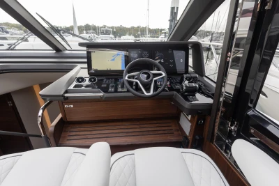 Luxurious 2025 Princess S65 yacht cockpit with advanced navigation systems and elegant design.
