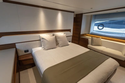 Luxurious bedroom interior of 2025 Princess S65 yacht with modern design and elegant furnishings.
