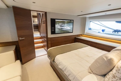 Luxurious interior of 2025 Princess S65 yacht with elegant bedroom and modern design.
