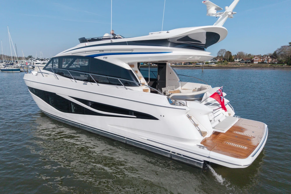 Luxurious 2026 Princess F58 yacht cruising on calm waters, showcasing sleek design and elegance.